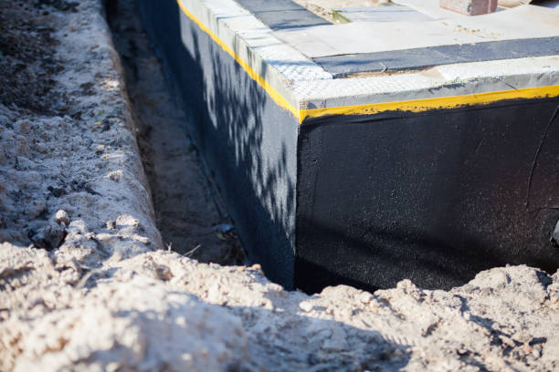 Professional Waterproofing technician working in Troy, AL
